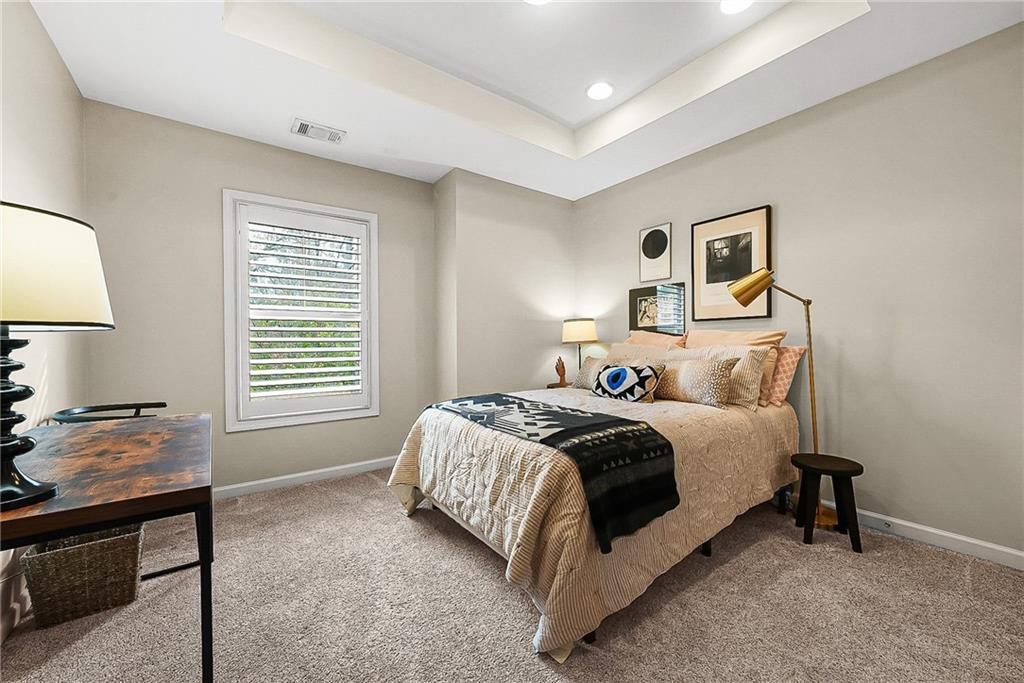 3715 Benton Lane Chamblee, GA 30341 - Photo 24 of 43 a spacious bedroom with a bed and a window