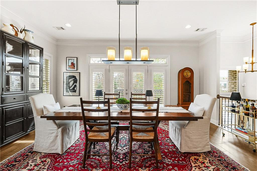 3715 Benton Lane Chamblee, GA 30341 - Photo 3 of 43 a dining room with furniture a chandelier and wooden floor