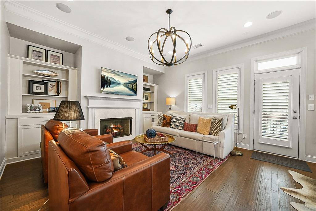 3715 Benton Lane Chamblee, GA 30341 - Photo 6 of 43 a living room with furniture a fireplace and a large window
