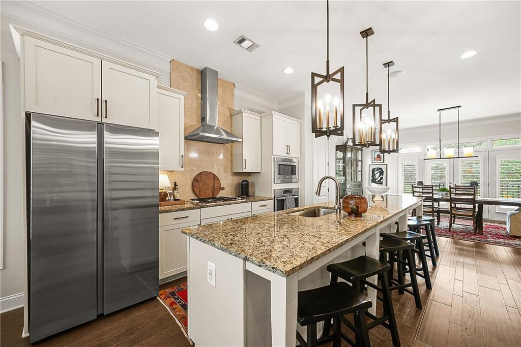 3715 Benton Lane Chamblee, GA 30341 - Photo 10 of 43 a kitchen with stainless steel appliances granite countertop furniture and a refrigerator