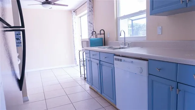 a spacious bathroom with a granite countertop sink a mirror and a