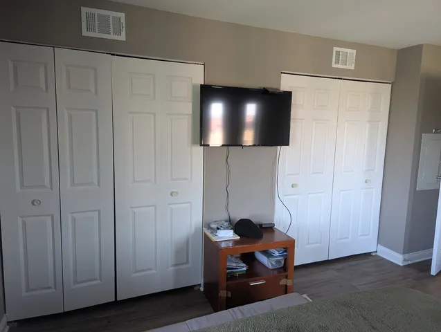 a room with furniture and wooden floor