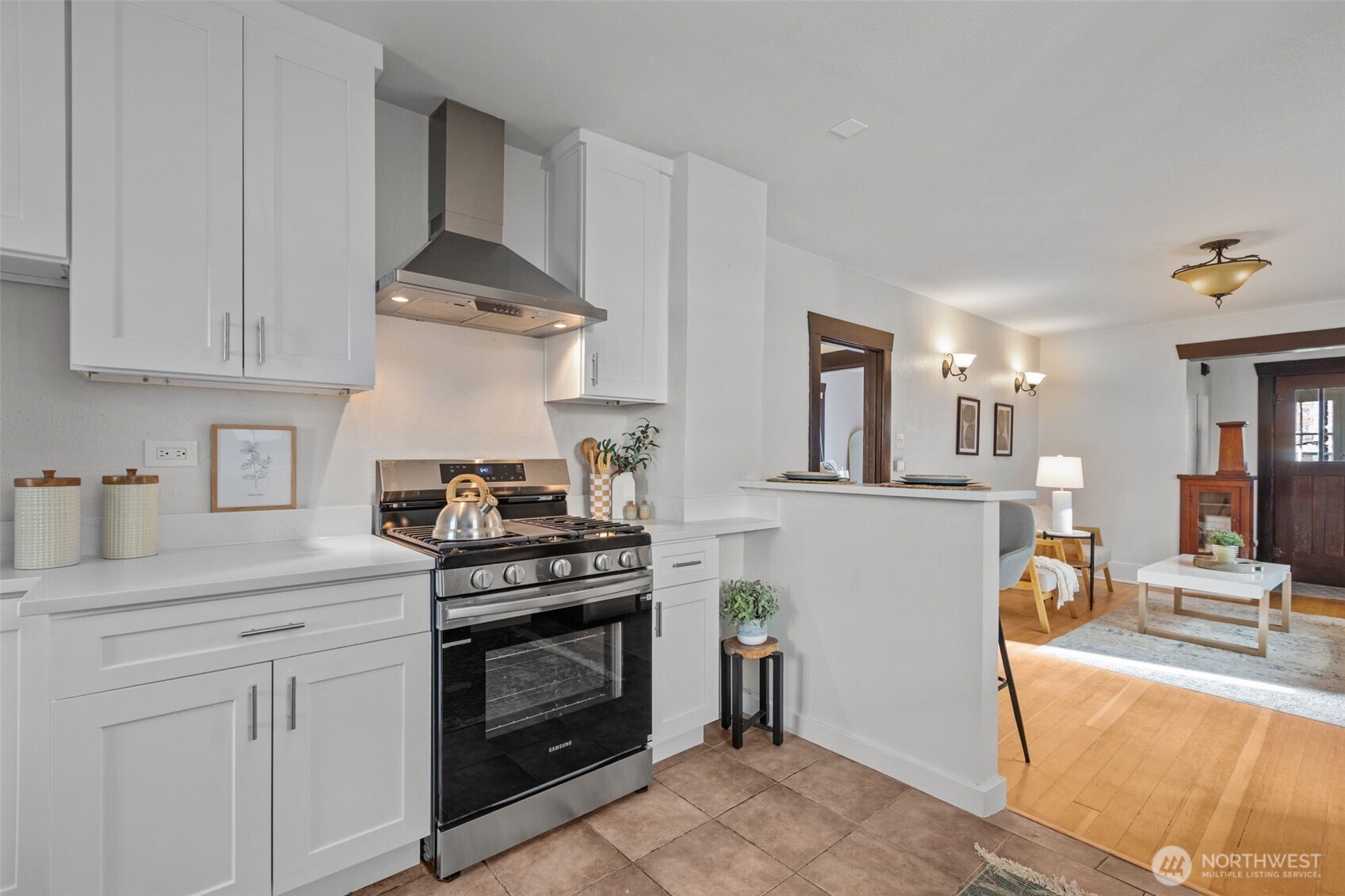 4219 South Mead Street Seattle, WA 98118 - Photo 11 of 40 a kitchen with stainless steel appliances granite countertop a stove and a sink