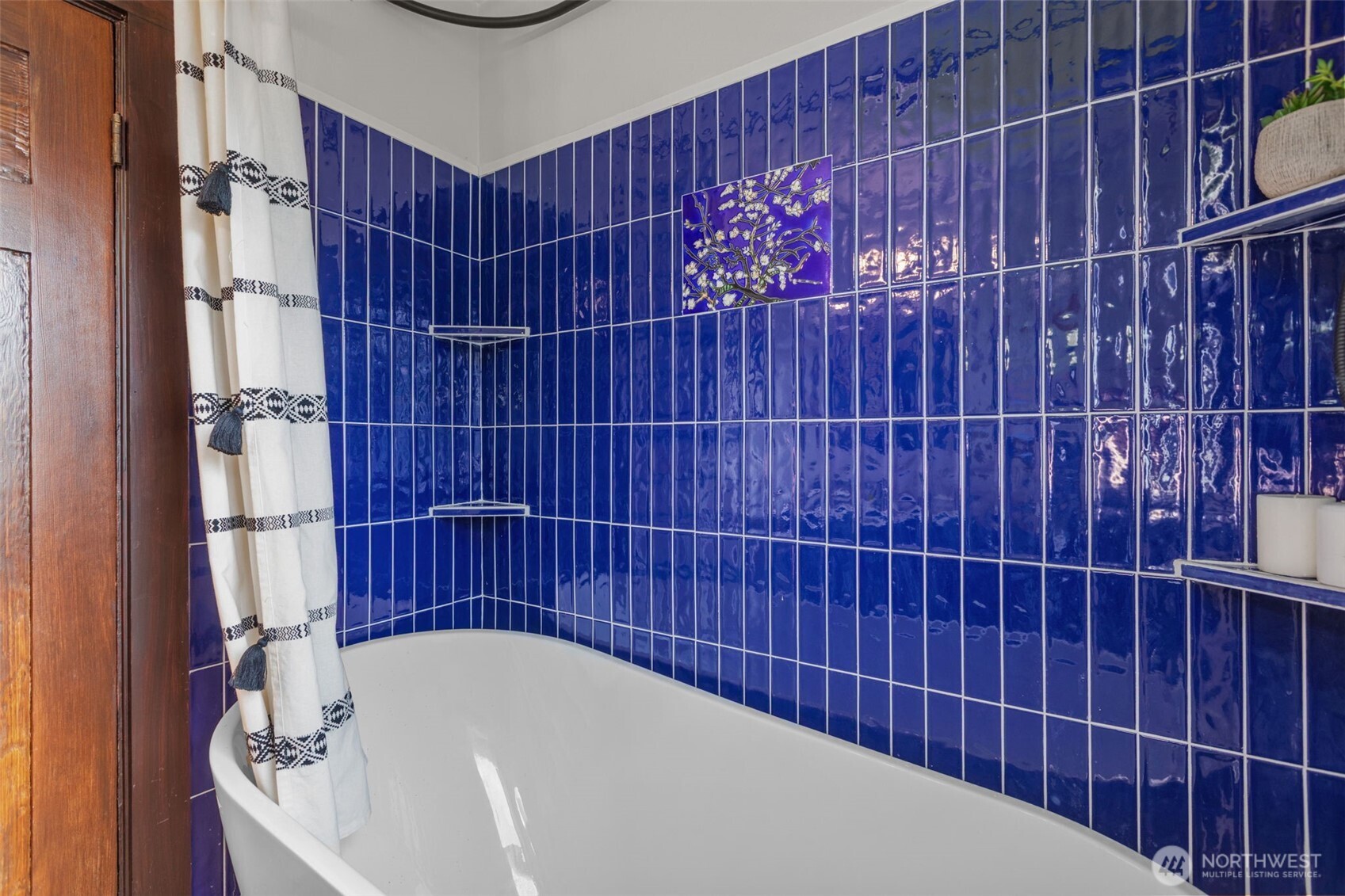 4219 South Mead Street Seattle, WA 98118 - Photo 18 of 40 a bathroom with a bathtub and shower