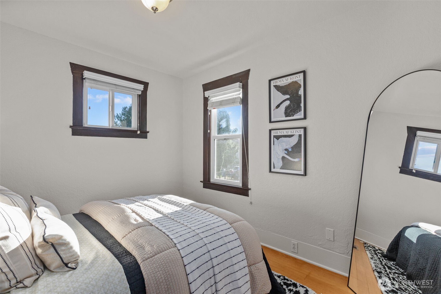 4219 South Mead Street Seattle, WA 98118 - Photo 19 of 40 a bedroom with a bed and the painting on the wall