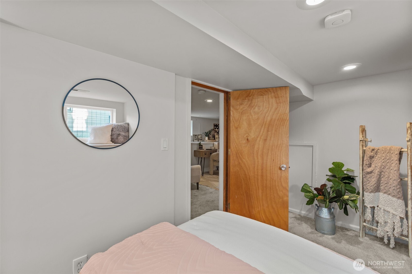 4219 South Mead Street Seattle, WA 98118 - Photo 31 of 40 a bedroom with a bed and a potted plant