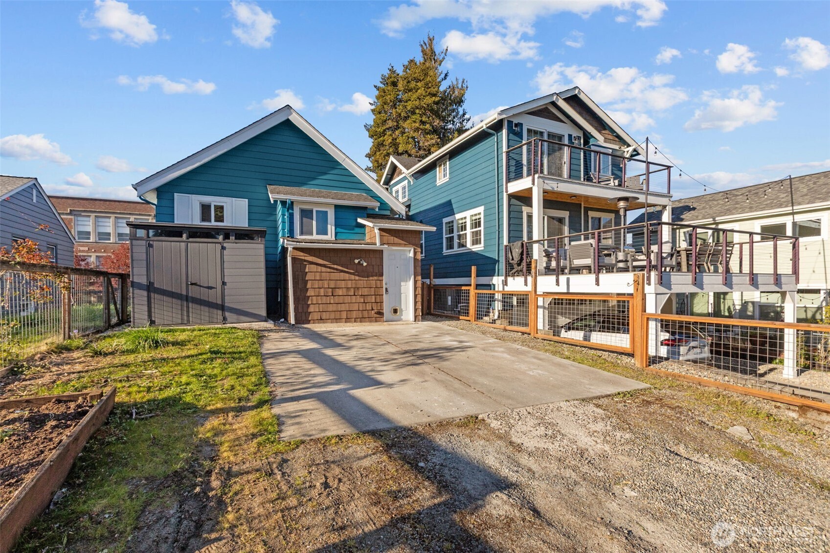 4219 South Mead Street Seattle, WA 98118 - Photo 36 of 40 a front view of a house with a yard and garage