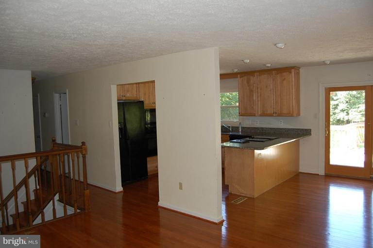 Kitchen off of living room and dining room