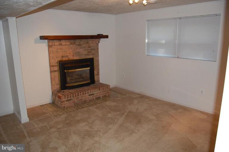 8160 Sinclair Mill Road Manassas, VA 20112 - Photo 9 of 15 Rec room with fireplace