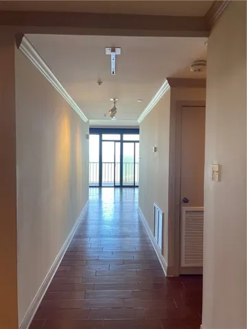a view of livingroom with hardwood floor and hallway