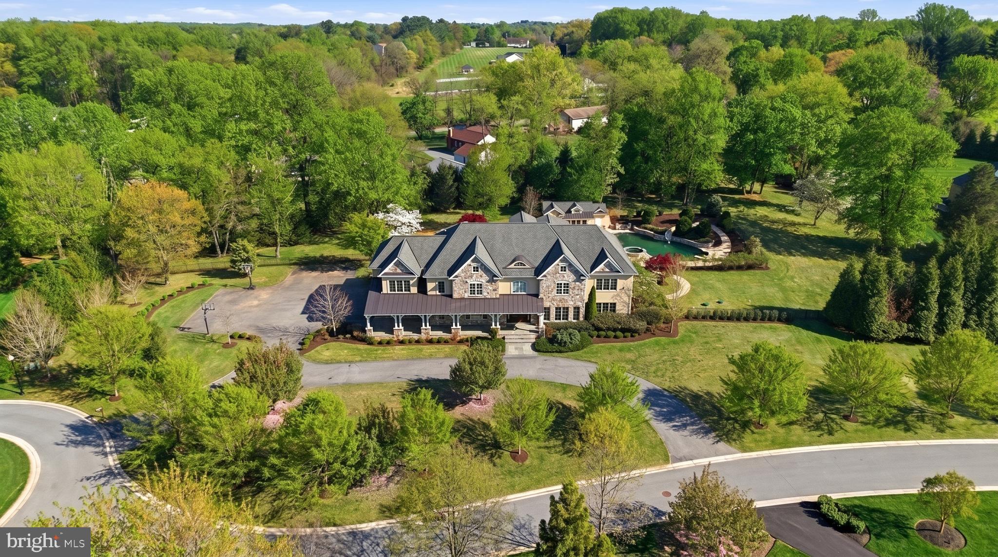 12228 Worthington Road Owings Mills, MD 21117 - Photo 3 of 4 an aerial view of a house with a yard basket ball court and outdoor seating