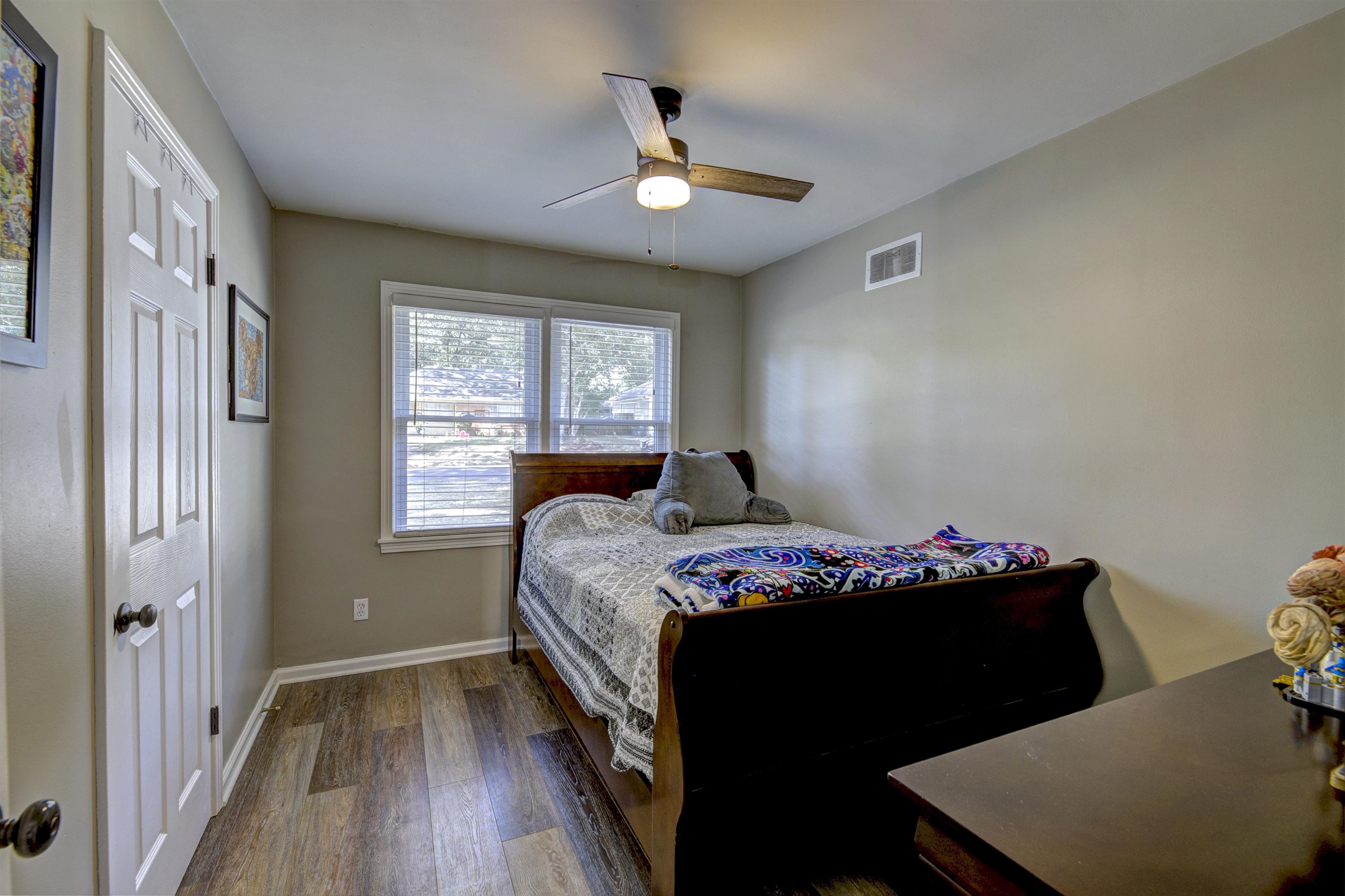 5061 Wingdale Road Memphis, TN 38117 - Photo 17 of 20 Bedroom featuring ceiling fan and new flooring