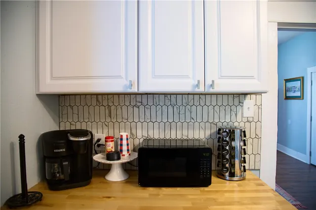 a kitchen with a stove and a fireplace