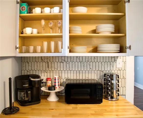 a kitchen with a stove and a cabinet