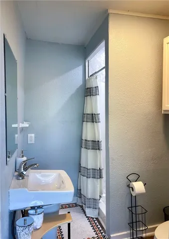 a room with a table and a lamp