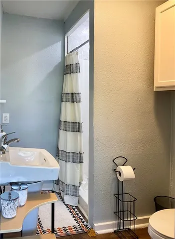 a bathroom with a sink and a toilet