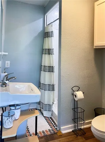 a very nice looking room with a large window and chandelier