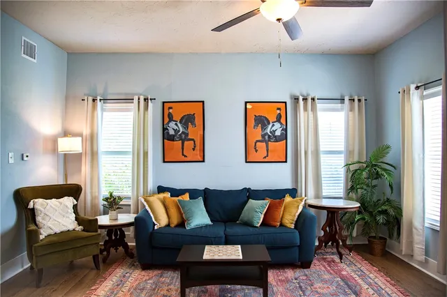 a living room with furniture and a large window