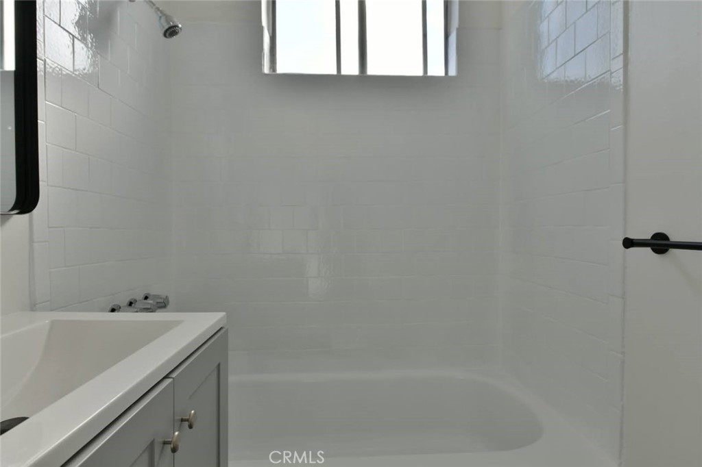 6221 Corona Avenue Bell Gardens, CA 90201 - Photo 14 of 65 a bathroom with a bathtub and sink