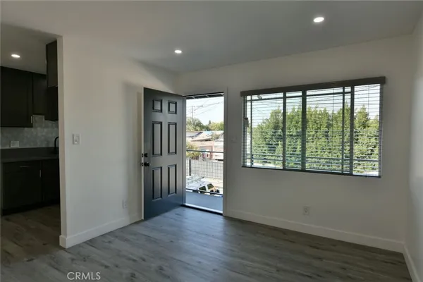 a view of a kitchen with a sink and a microwave