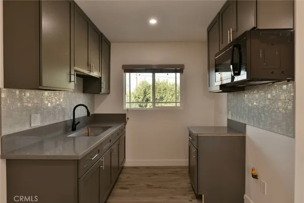 a close view of sink and cabinets