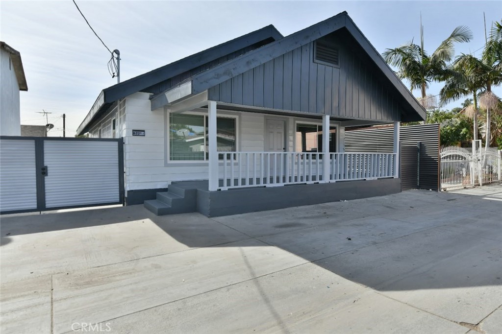 6221 Corona Avenue Bell Gardens, CA 90201 - Photo 30 of 65 a front view of a house with garage