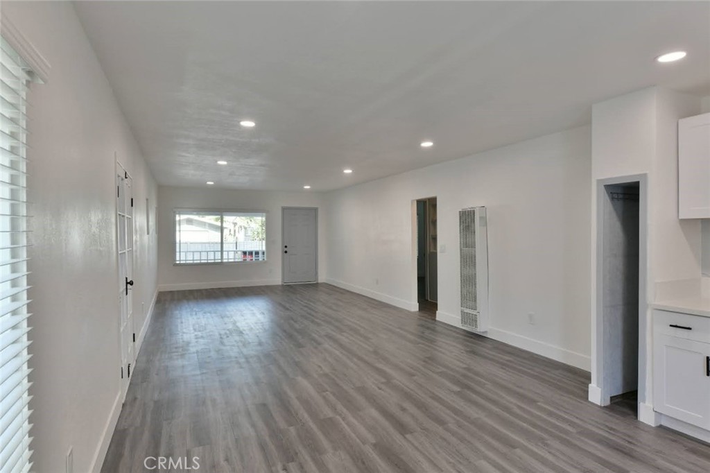 6221 Corona Avenue Bell Gardens, CA 90201 - Photo 41 of 65 a view of empty room with wooden floor and window