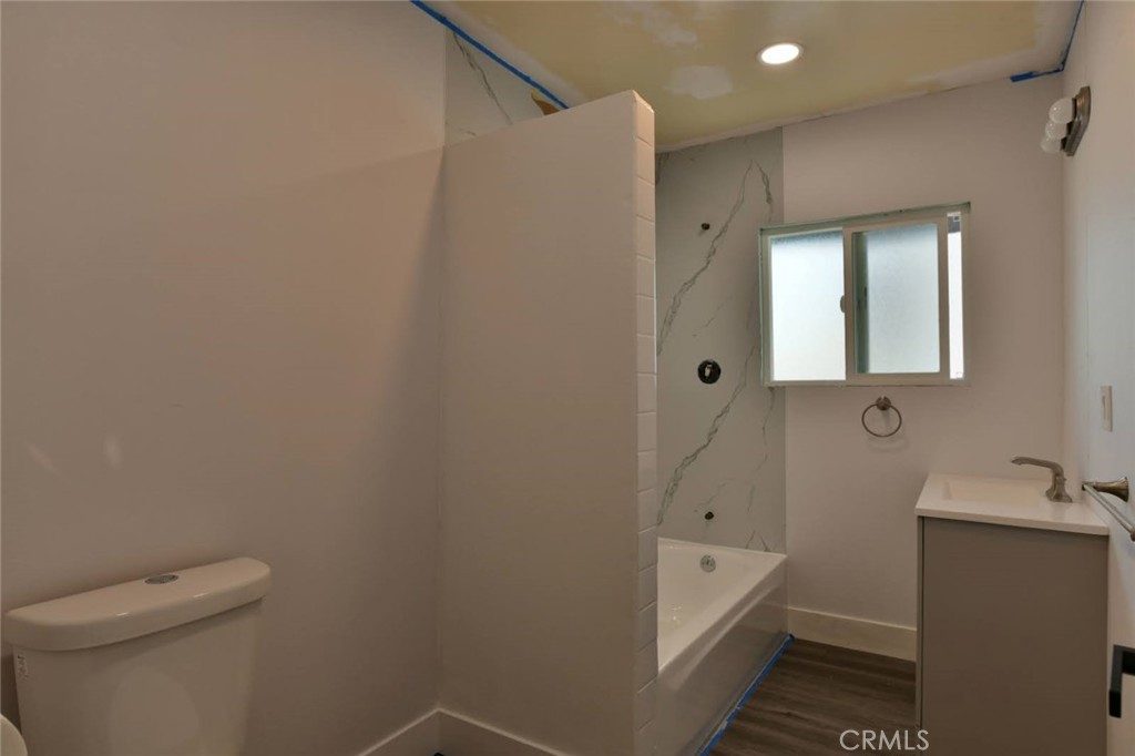 6221 Corona Avenue Bell Gardens, CA 90201 - Photo 44 of 65 a bathroom with a bathtub and shower