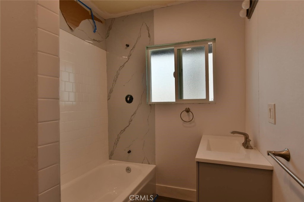6221 Corona Avenue Bell Gardens, CA 90201 - Photo 46 of 65 a bathroom with a sink a toilet and shower