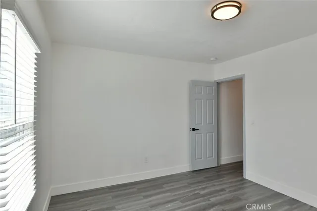 a bathroom with a shower a toilet and sink