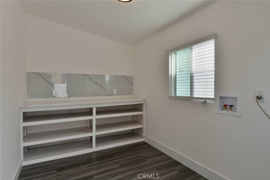 6221 Corona Avenue Bell Gardens, CA 90201 - Photo 51 of 65 a view of room with wooden floor and windows