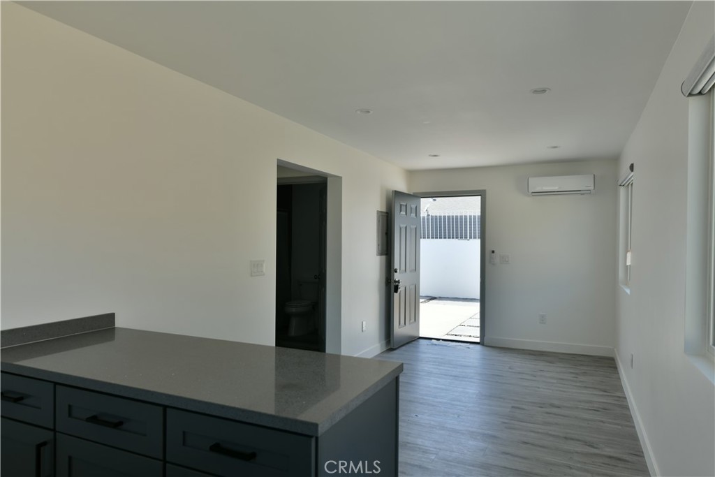 6221 Corona Avenue Bell Gardens, CA 90201 - Photo 58 of 65 a view of a hallway with wooden floor and closet