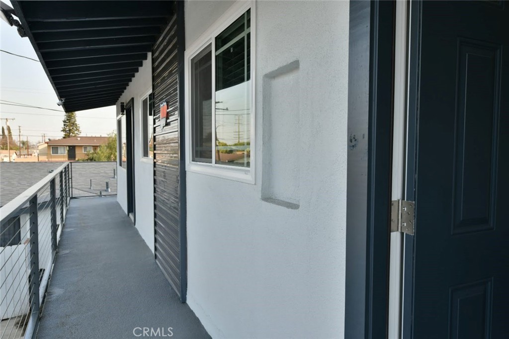 6221 Corona Avenue Bell Gardens, CA 90201 - Photo 6 of 65 a view of a hallway with wooden fence