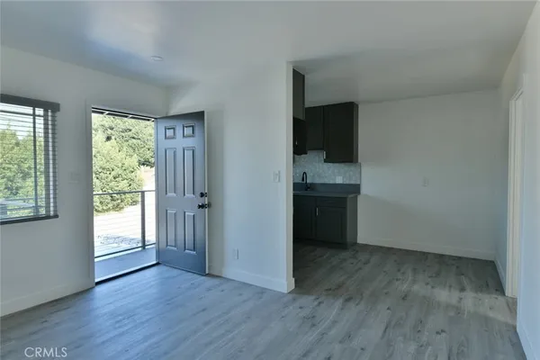 a kitchen with a sink a stove and a microwave
