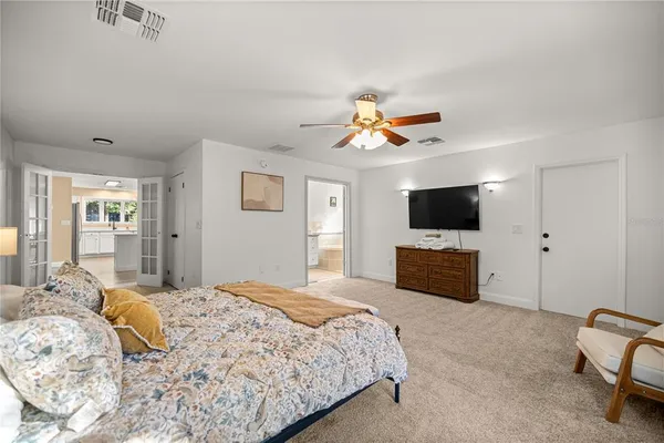 a bedroom with a bed and a cabinet