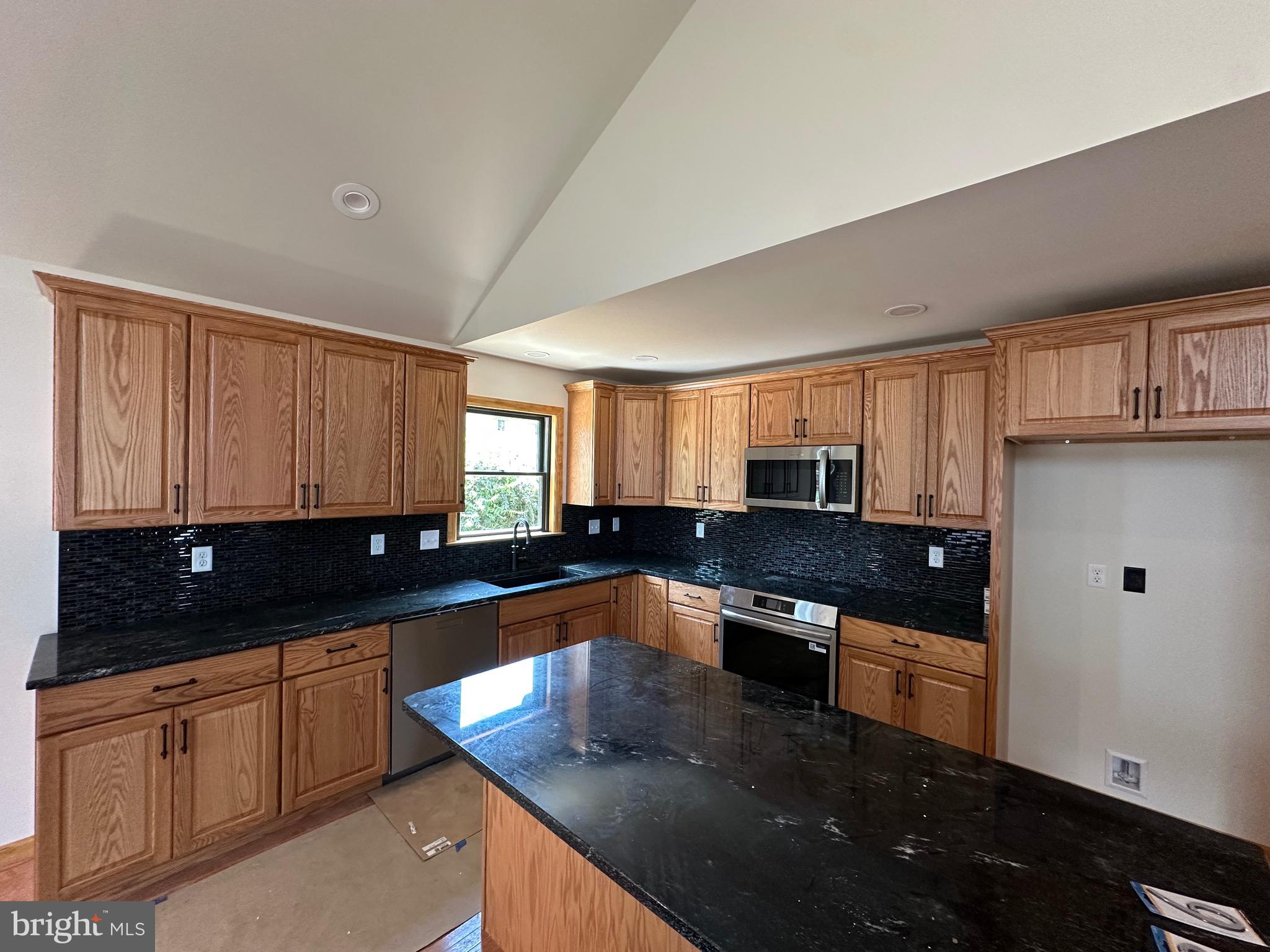0 Braeburn Road Elizabethtown, PA 17022 - Photo 11 of 13 a kitchen with stainless steel appliances granite countertop a sink a stove counter space and cabinets