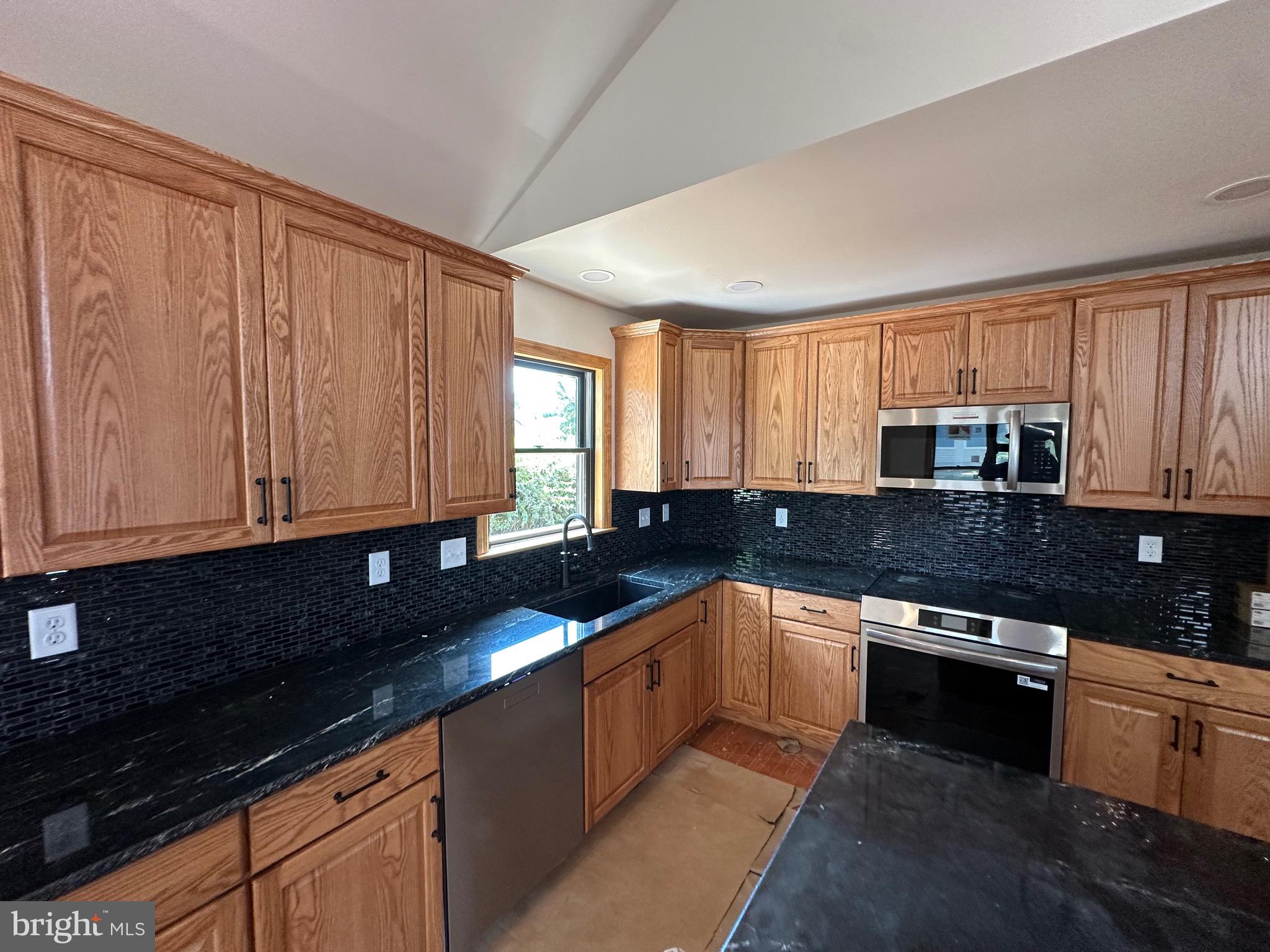 0 Braeburn Road Elizabethtown, PA 17022 - Photo 4 of 13 a kitchen with stainless steel appliances granite countertop a sink stove and cabinets