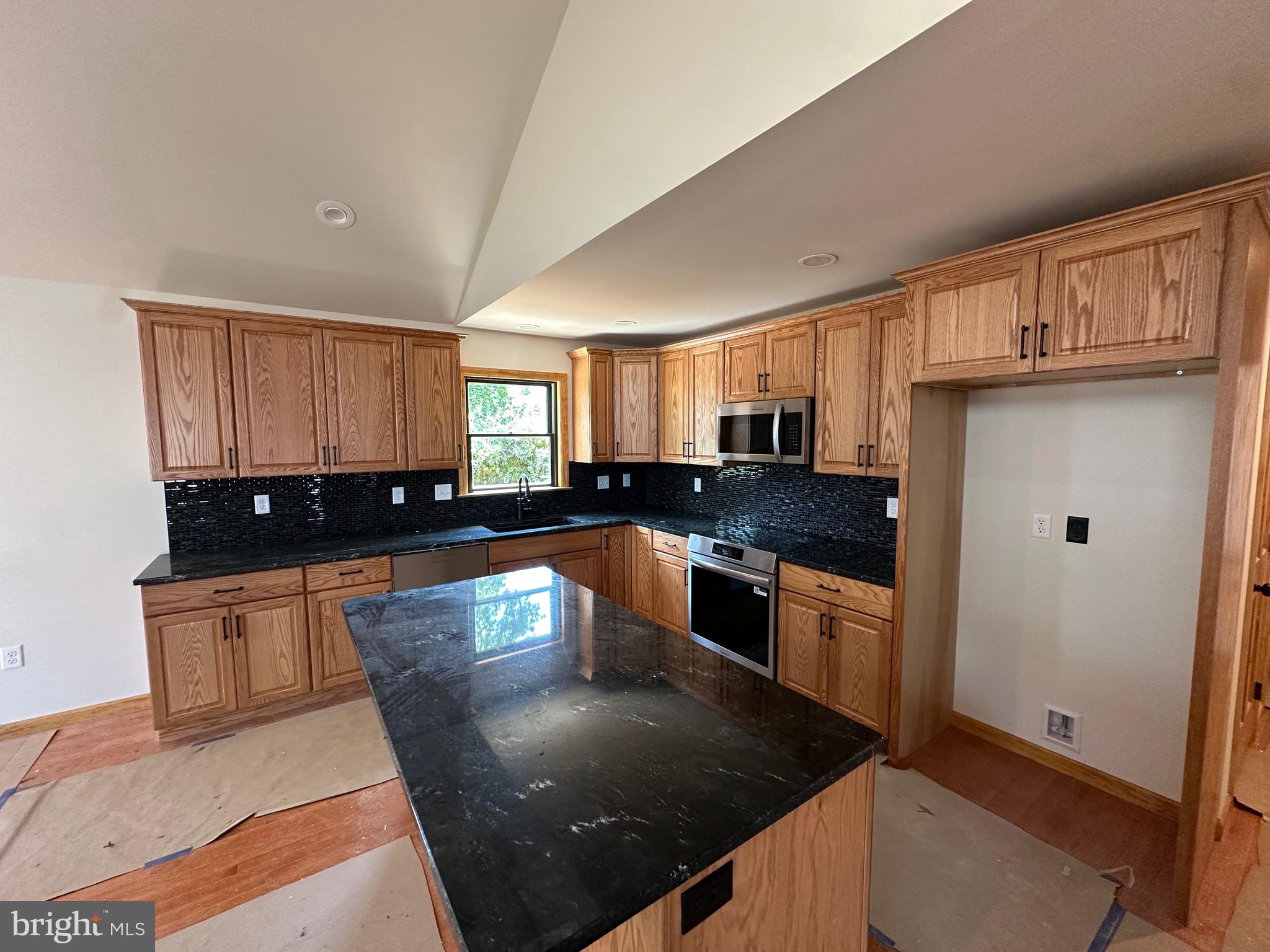 0 Braeburn Road Elizabethtown, PA 17022 - Photo 5 of 13 a kitchen with stainless steel appliances granite countertop a sink a stove and a refrigerator