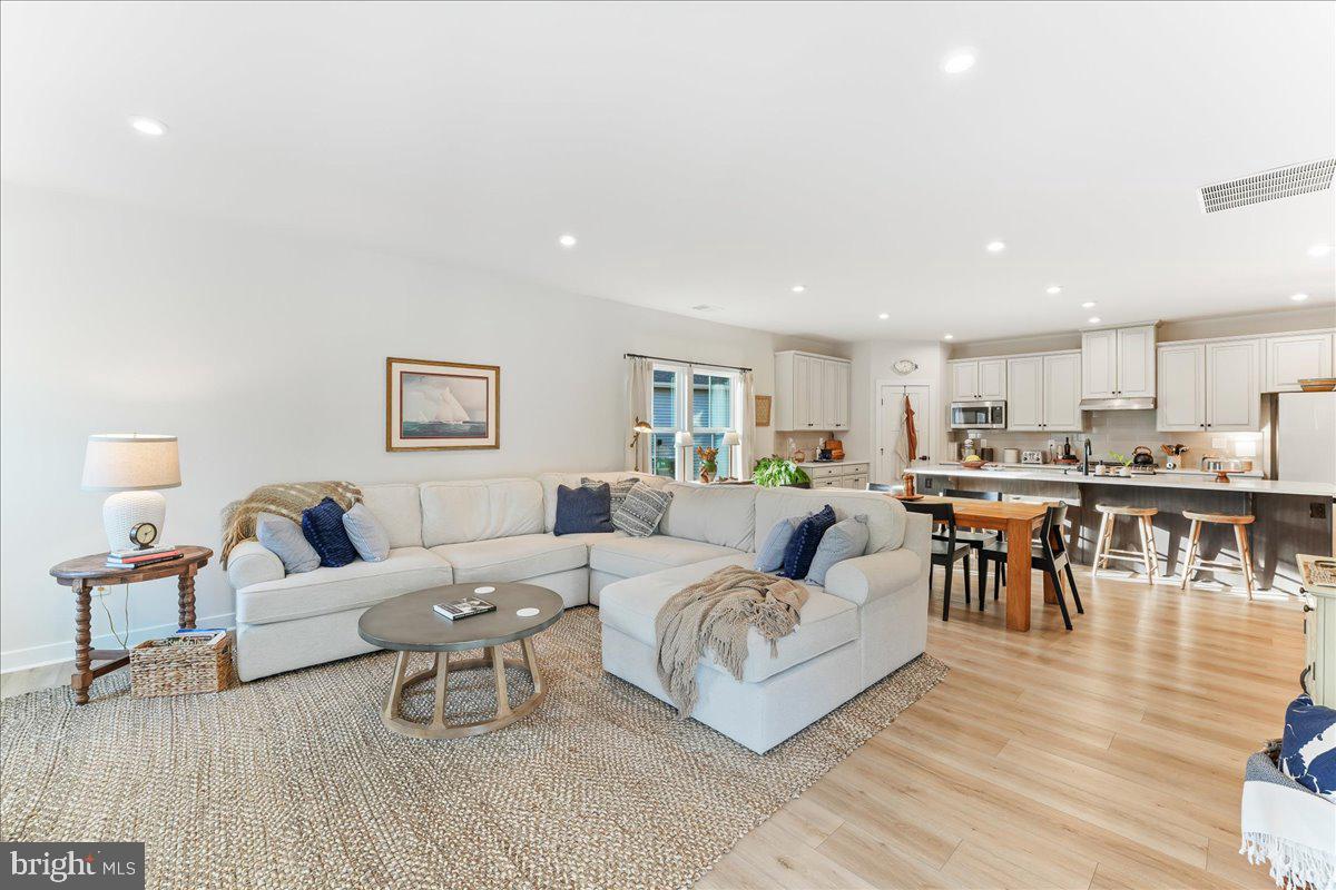 37360 Kestrel Way Ocean View, DE 19970 - Photo 16 of 39 Luxury Vinyl Plank Flooring Complements the Space