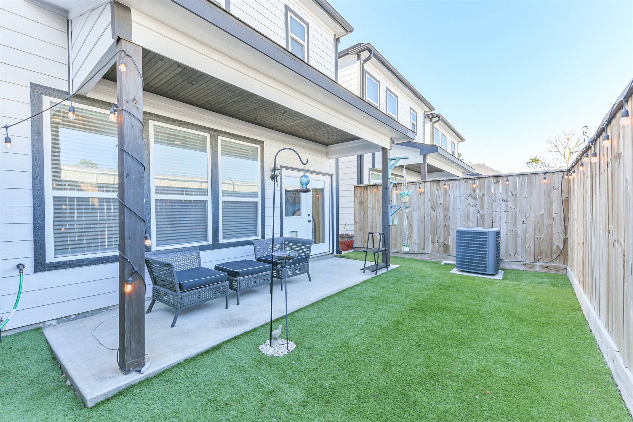 1010 Melneeka Lane Houston, TX 77091 - Photo 20 of 39 a view of an house with backyard porch and sitting area