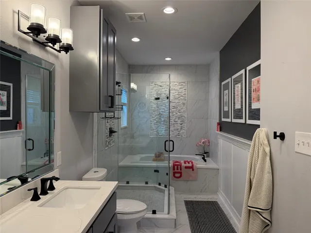 a bath room with a bath tub and a shower