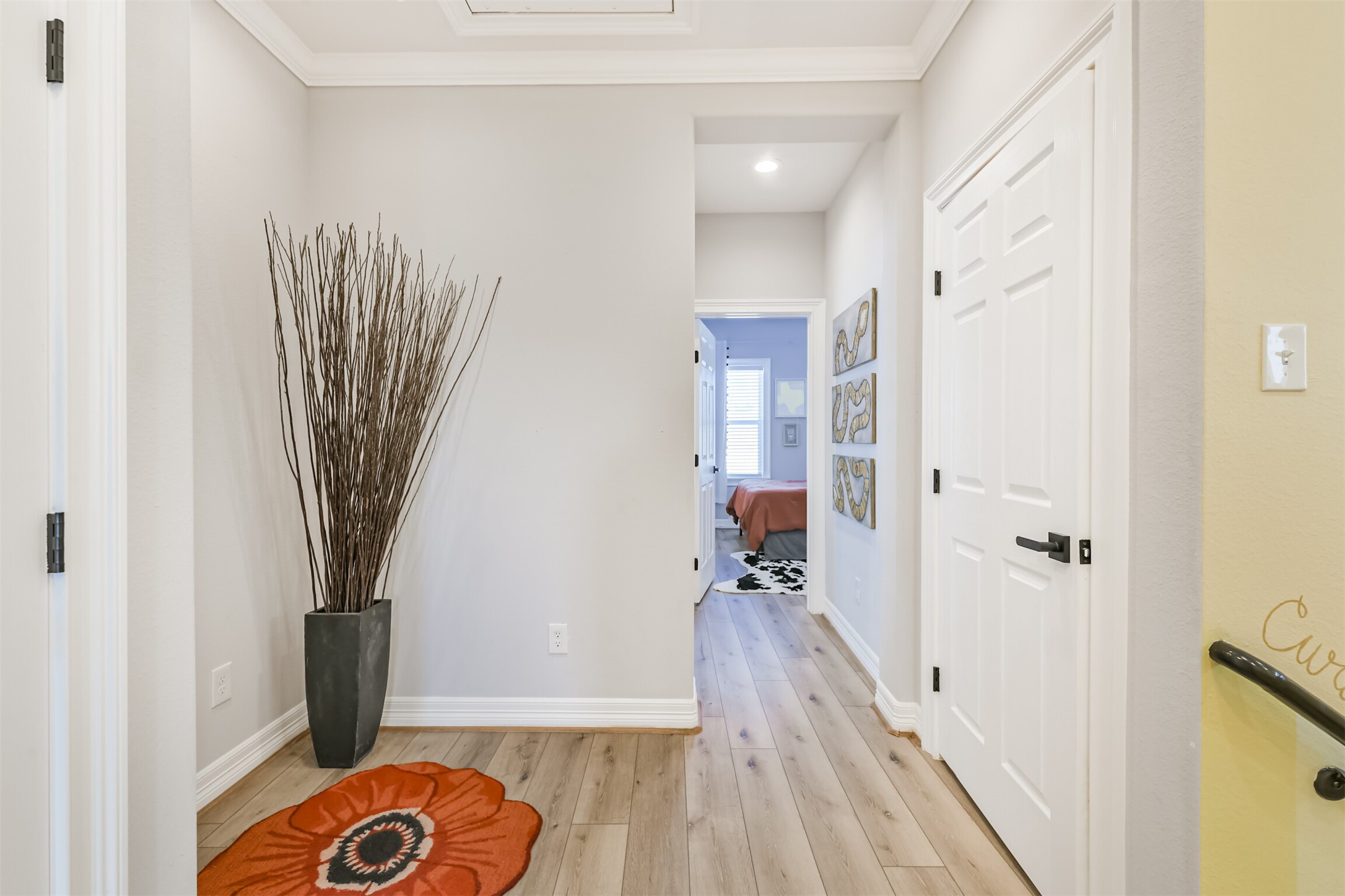 1010 Melneeka Lane Houston, TX 77091 - Photo 23 of 39 a view of a hallway with wooden floor and a bathroom