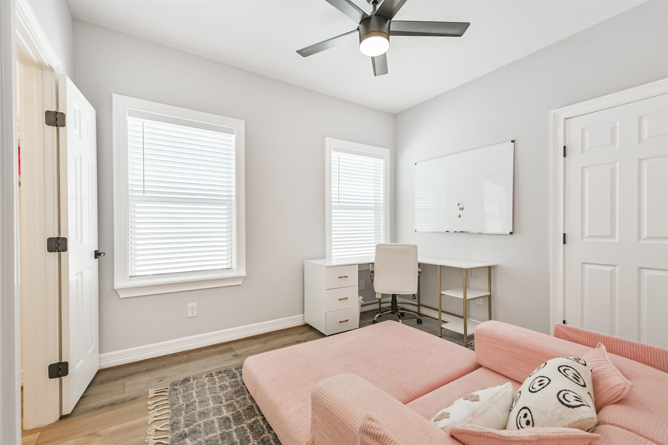 1010 Melneeka Lane Houston, TX 77091 - Photo 27 of 39 a bedroom with a bed and a chandelier