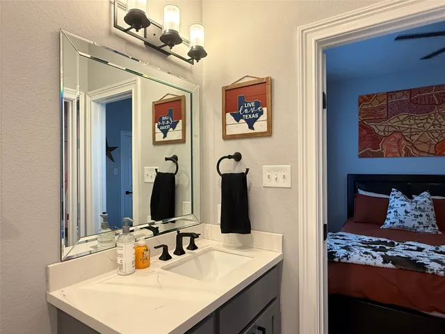 a view of a workspace with furniture and window