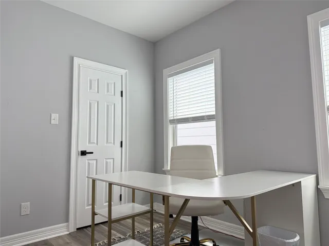 a view of staircase with wooden floor and a rug