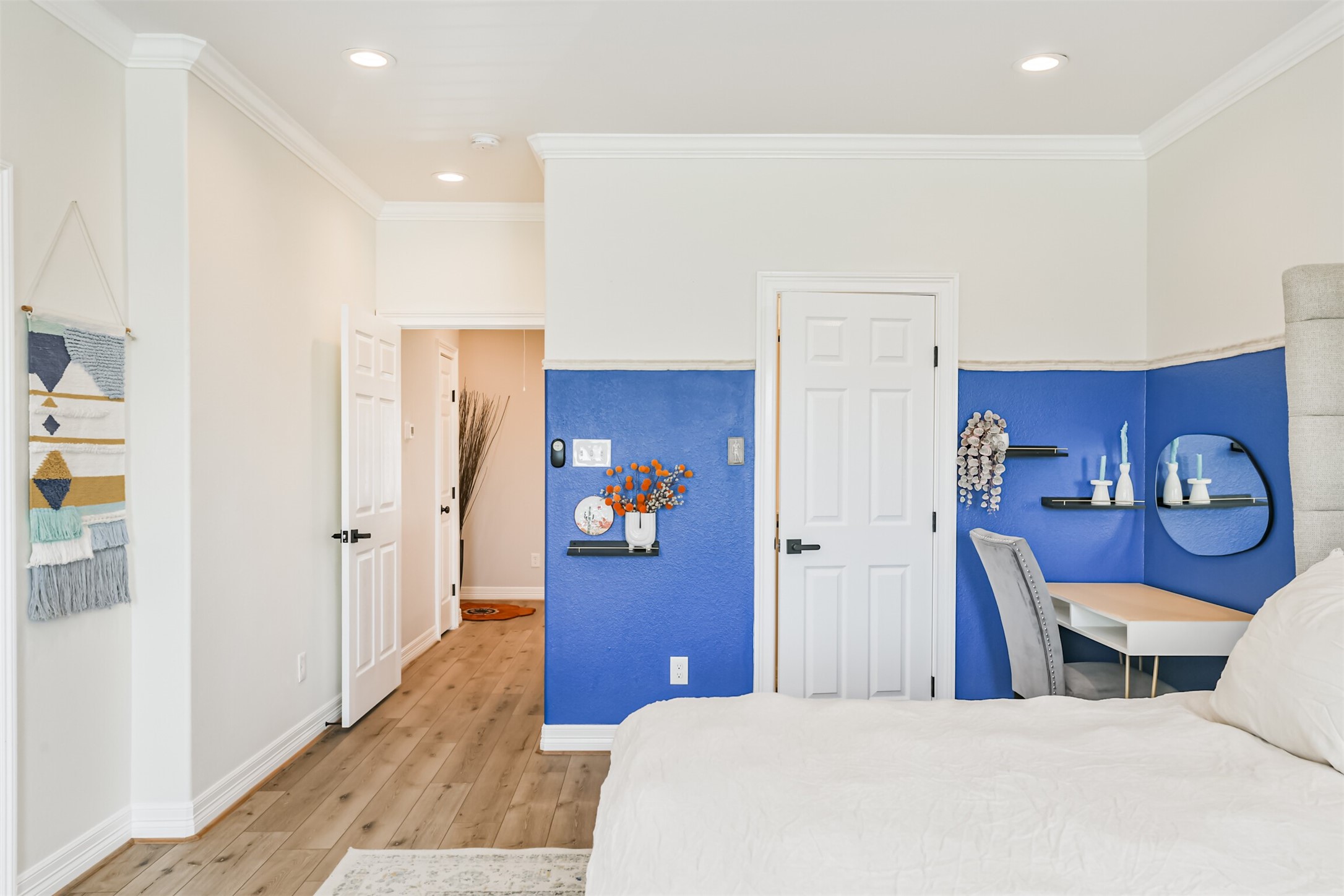 1010 Melneeka Lane Houston, TX 77091 - Photo 29 of 39 a bedroom with a bed and wooden floor