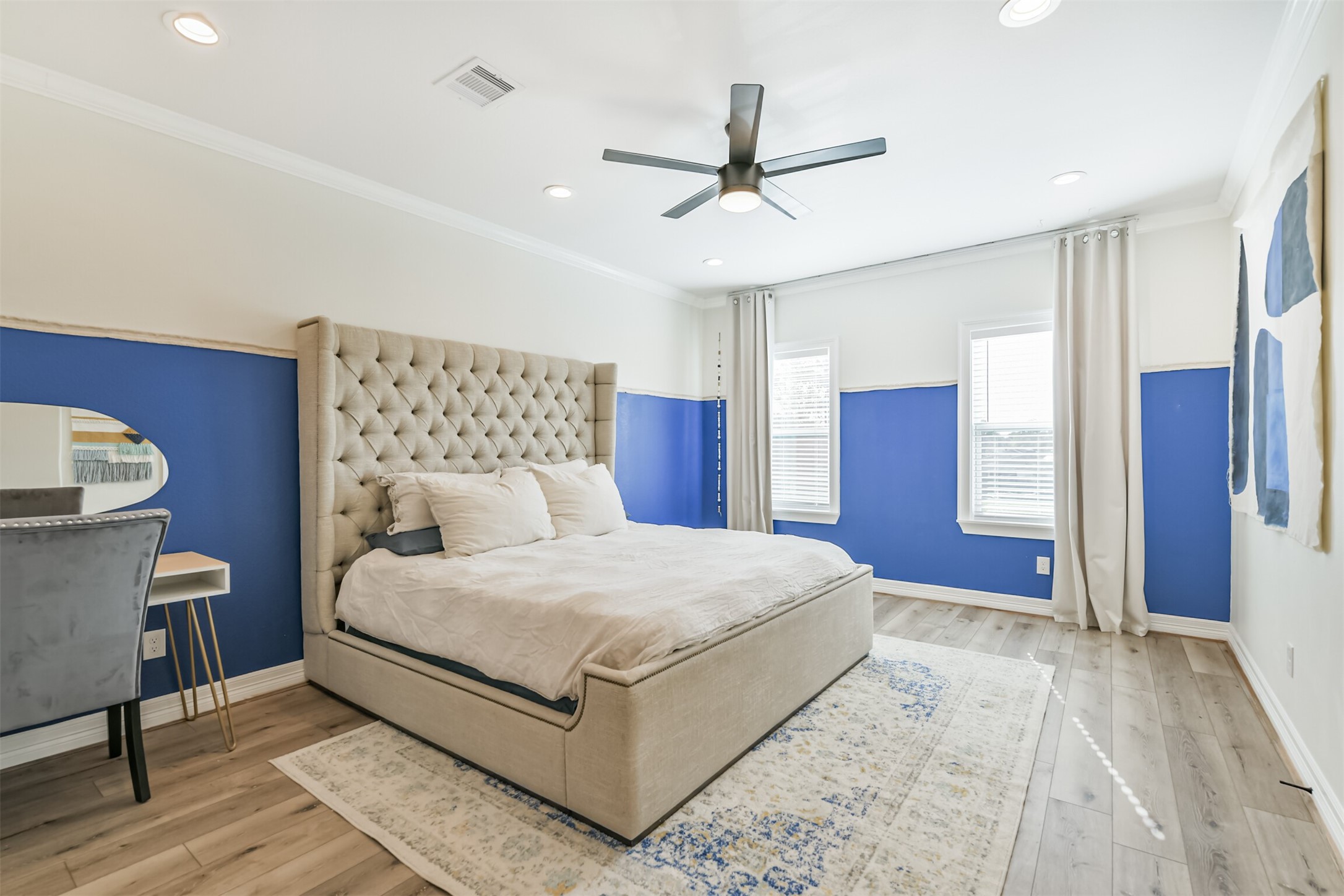 1010 Melneeka Lane Houston, TX 77091 - Photo 31 of 39 a bedroom with a large bed chandelier and a window