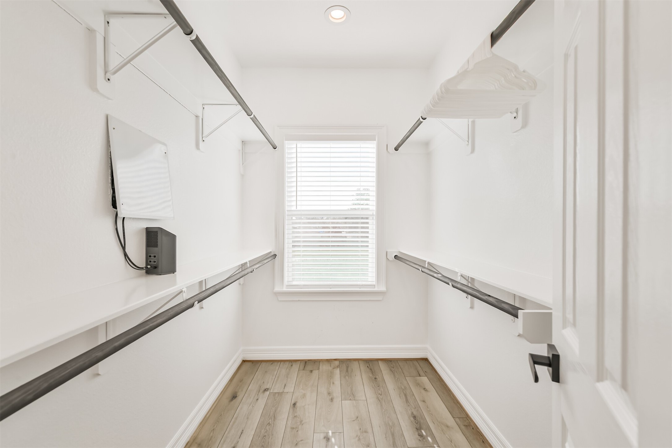 1010 Melneeka Lane Houston, TX 77091 - Photo 34 of 37 Plenty of space in this closet. Behind the door is built in shelving for shoes.