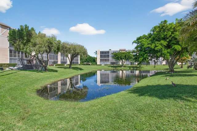 an aerial view of residential houses with outdoor space and street view