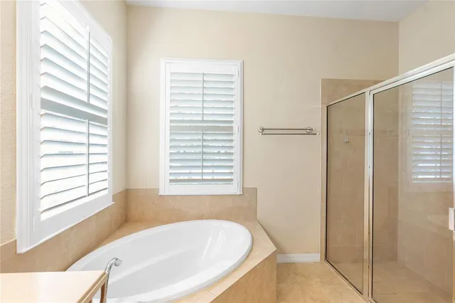 a white bath tub sitting next to a window